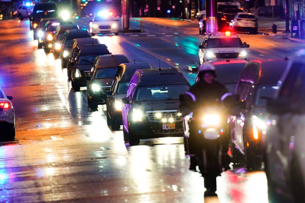 The funeral procession for the victims of a deadly row house fire arrive for services at Temple University in Philadelphia, Monday, Jan. 17, 2022. (AP Photo/Matt Rourke)