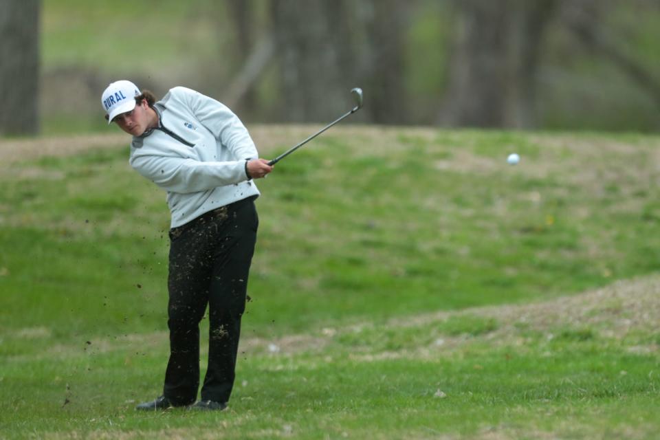Washburn Rural's Giles Frederickson makes an approach shot to the green of hole no. 11 April 20 at Village Greens in Meriden.