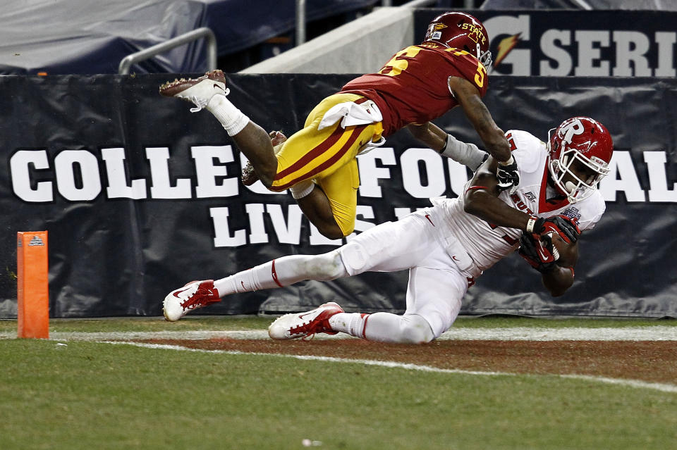 NEW YORK - DECEMBER 30: Brandon Coleman #17 of the Rutgers Scarlet Knights scores a touchdown in front of Jeremy Reeves #5 of the Iowa State Cyclones during the New Era Pinstripe Bowl at Yankee Stadium on December 30, 2011 in the Bronx Borough of New York City. (Photo by Jeff Zelevansky/Getty Images)