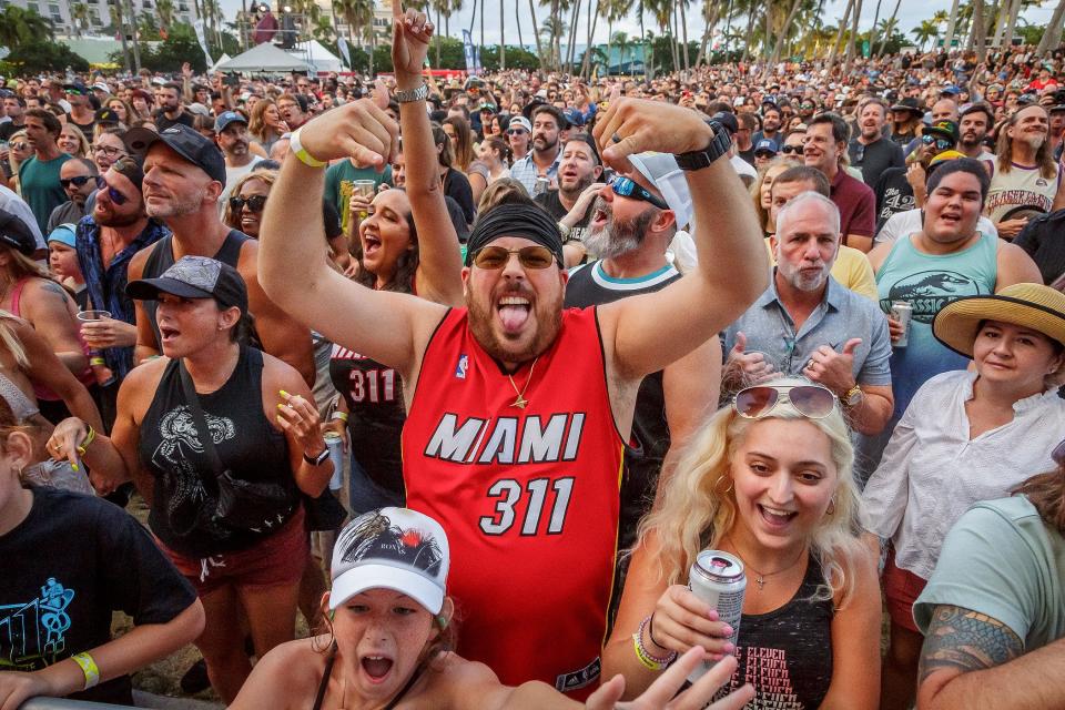 311 fans cheer during SunFest in West Palm Beach, Fla., on May 7, 2023. 