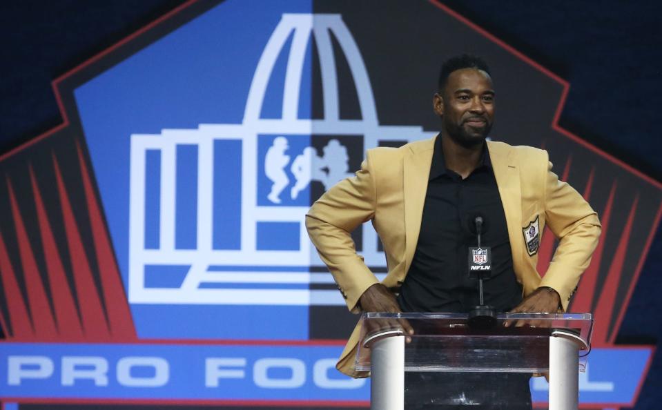 Calvin Johnson speaks during the Pro Football Hall of Fame enshrinement ceremony.