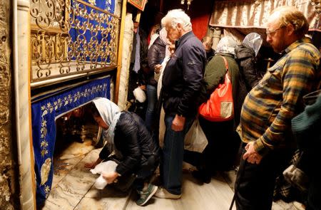 Tourists visit the grotto at the Church of the Nativity in Bethlehem in the occupied West Bank, December 10, 2018. REUTERS/Raneen Sawafta