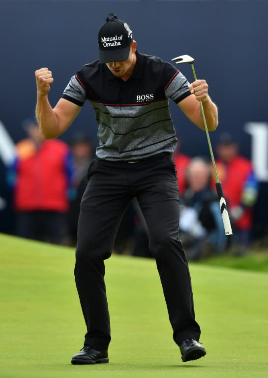 Winner, Sweden's Henrik Stenson celebrates making his birdie putt on the 18th green during his final round 63 to win the Championship on day four of the 2016 British Open Golf Championship at Royal Troon in Scotland on July 17, 2016