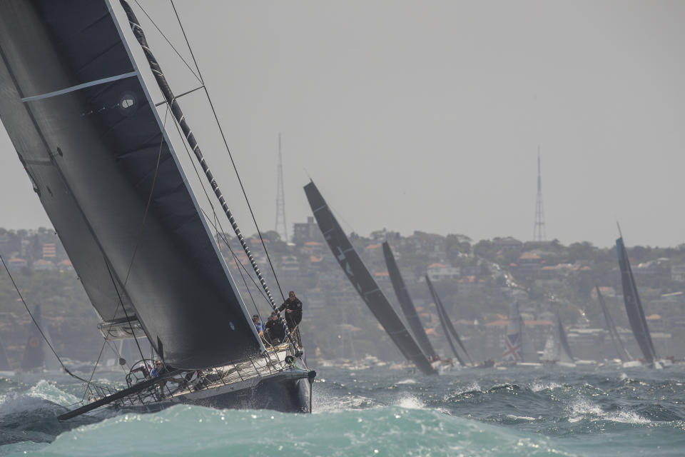 Black Jack heads to the outside marker during the start of the Sydney Hobart yacht race on Sydney Harbour, Thursday, Dec. 26, 2019. (AP Photo/Steve Chirsto)