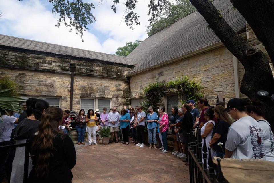 People pause in prayer before the ceremonial release of 21 butterflies, in remembrance of the victims of the Robb Elementary school shooting a year ago, at the St. Philip's Episcopal Church in Uvalde on May 24, 2023.