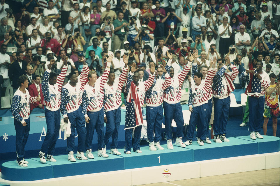The Dream Team receives its gold medals during the 1992 Olympics – with no Reebok logos visible. (Photo by Dimitri Iundt/Corbis/VCG via Getty Images)