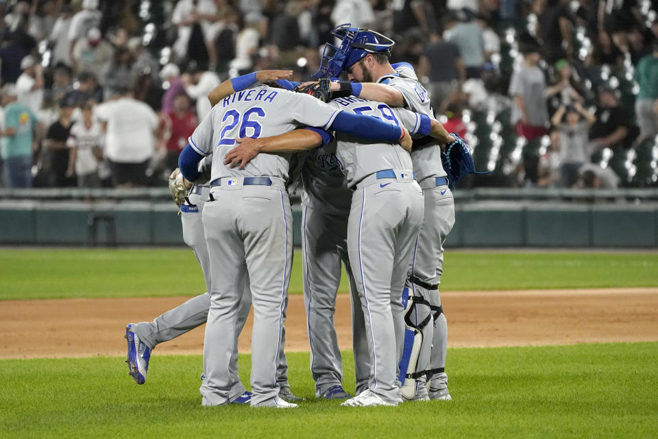 The Kansas City Royals celebrate the team's 3-2 win over the Chicago White Sox after a baseball game Thursday, Aug. 5, 2021, in Chicago. (AP Photo/Charles Rex Arbogast)