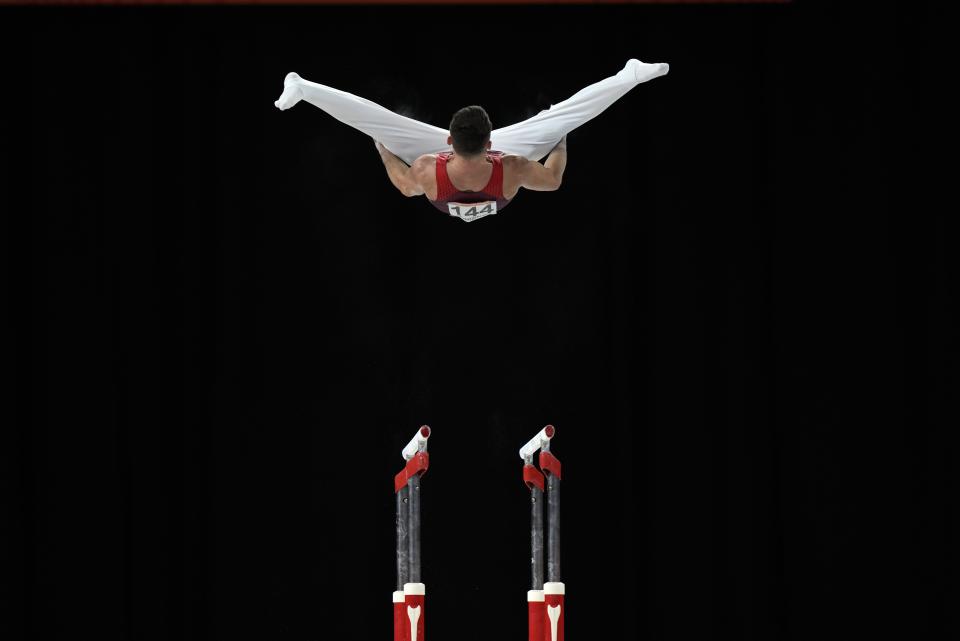 Giarnni Regini-Moran of Team England competes in the Men's Parallel Bars finals at the Commonwealth Games, in Birmingham, England, Tuesday, Aug. 2, 2022. (AP Photo/Manish Swarup)