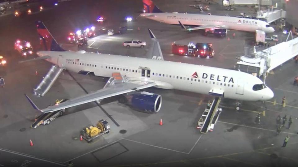 <div>Emergency crews are seen surrounding the plane on Monday, May 6 in Seattle.</div> <strong>(Port of Seattle/SEA Airport)</strong>