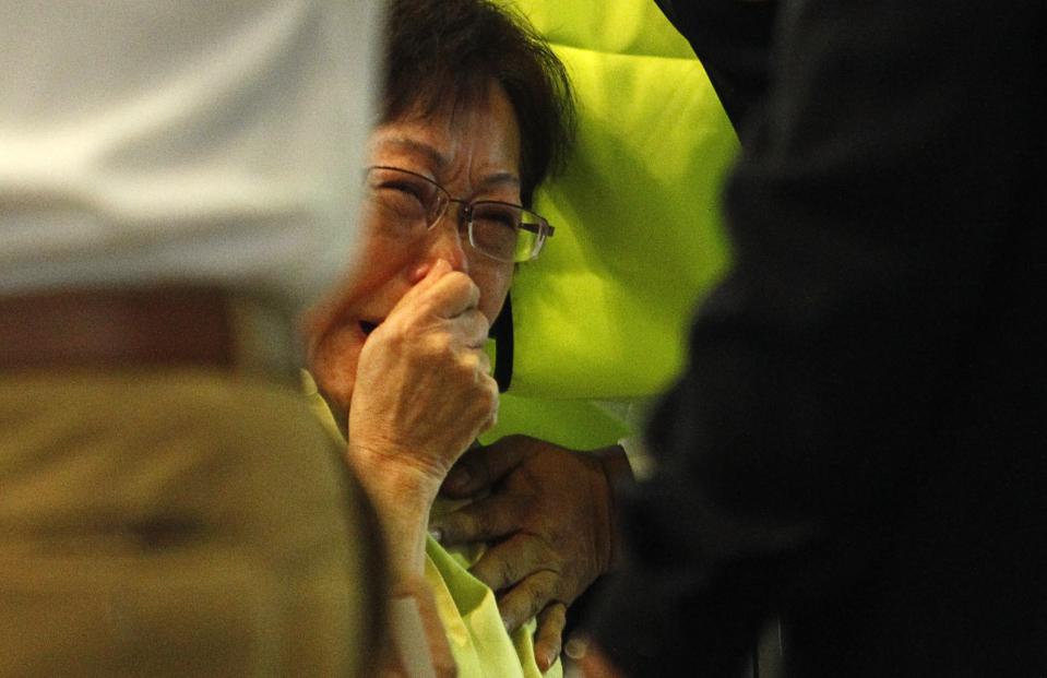 Siti Dina, whose daughter was on board flight MH17, weeps after seeing her name on the list of passengers at Kuala Lumpur International Airport in Sepang, yesterday. – Reuters pic, July 19, 2014.