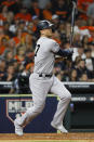 New York Yankees' Giancarlo Stanton watches his home run against the Houston Astros during the sixth inning in Game 1 of baseball's American League Championship Series Saturday, Oct. 12, 2019, in Houston. (AP Photo/Matt Slocum)