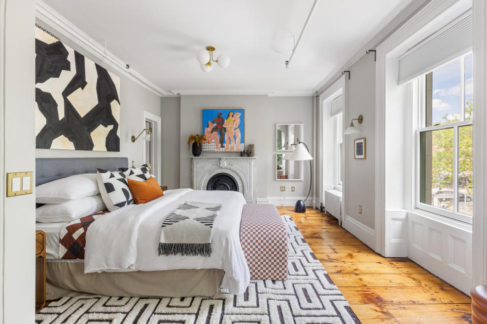 light grey bedroom with artwork