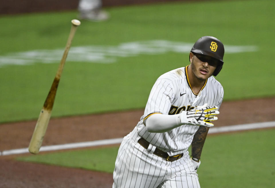 Manny Machado of the San Diego Padres hits a walk-off grand slam during the 10th inning of a game against the Texas Rangers. (Photo by Denis Poroy/Getty Images)