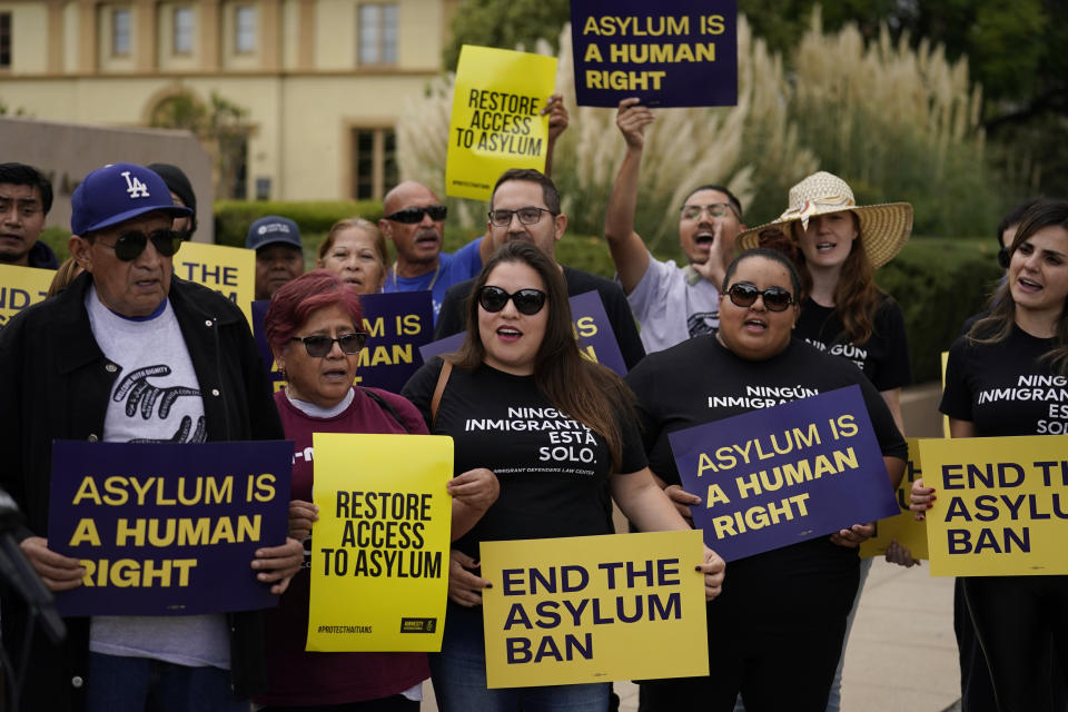 Demonstrators shout slogans outside of the Richard H. Chambers U.S. Court of Appeals ahead of an asylum hearing, Tuesday, Nov. 7, 2023, in Pasadena, Calif. (AP Photo/Marcio Jose Sanchez)