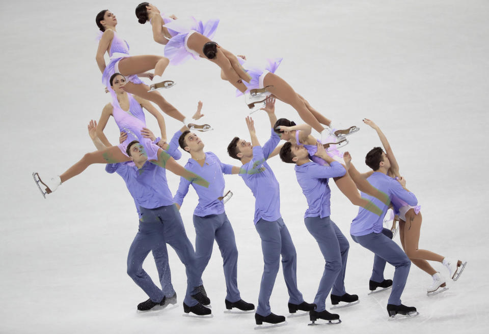 <p>In this multiple exposure image Natalia Zabiiako and Alexander Enbert of the Olmpic Athletes of Russia perform in the pair figure skating short program in the Gangneung Ice Arena at the 2018 Winter Olympics in Gangneung, South Korea, Wednesday, Feb. 14, 2018. (AP Photo/Julie Jacobson) </p>