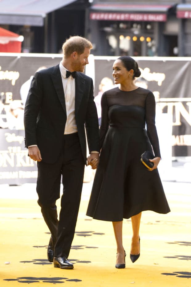 <p>Meghan dazzled at the <em>Lion King </em>premiere in a black dress by Jason Wu, featuring a sheer panel and sleeves, which she accessorized with diamond stud earrings with removable black jackets. We're glad she looked this stunning because it was at this event that she met Beyoncé!</p>