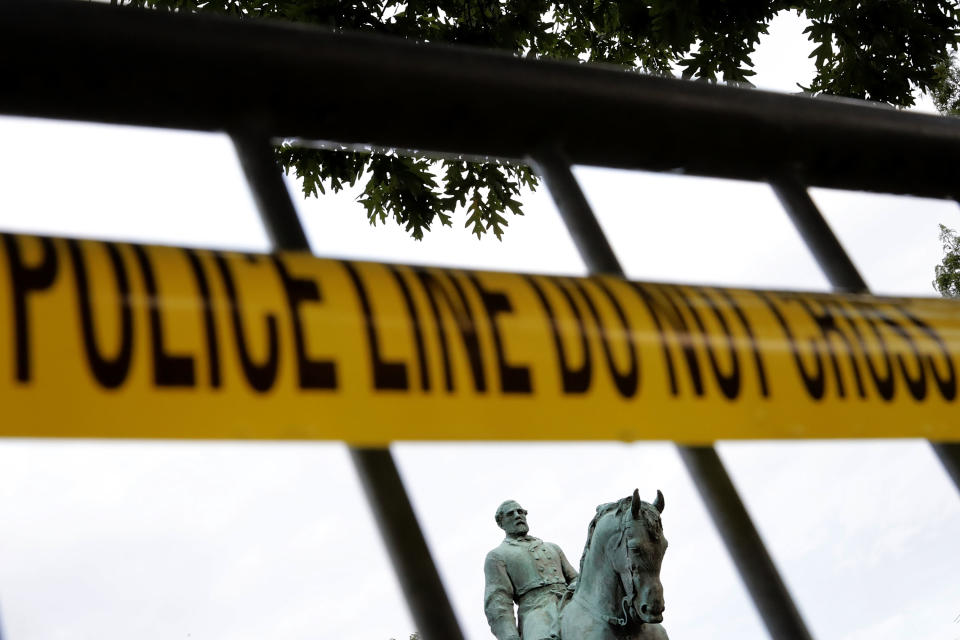 <p>The statue of Confederat Gen. Robert E. Lee stands in the center of Emancipation Park the day after the Unite the Right rally devolved into violence August 13, 2017 in Charlottesville, Virginia. The Charlottesville City Council voted to remove the statue and change the name of the space from Lee Park to Emancipation Park, sparking protests from white nationalists, neo-Nazis, the Ku Klux Klan and members of the ‘alt-right.’ (Chip Somodevilla/Getty Images) </p>