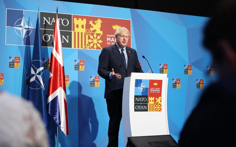 Boris Johnson addresses a press conference at the end of a Nato summit in Madrid yesterday - Anadolu Agency