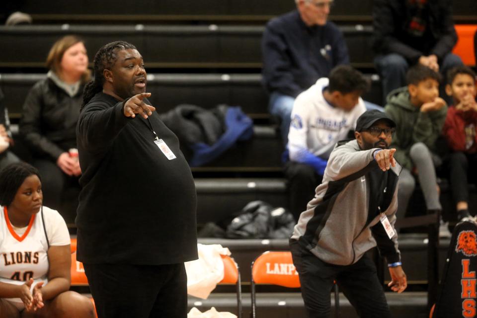 Lanphier girls basketball head coach Doug Collins, left, directs the team alongside assistant Tony Daniel during a game against Southeast at the new Lober-Nika Gymnasium on Jan. 15, 2024.