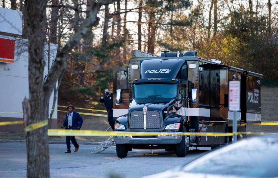 Investigators with the Durham Police Department work at the Circle K gas station near Fayetteville Road and N.C. Highway 54 in Durham, N.C. after the fatal shooting of a man by police occurred there early Wednesday morning, Jan. 12, 2022.