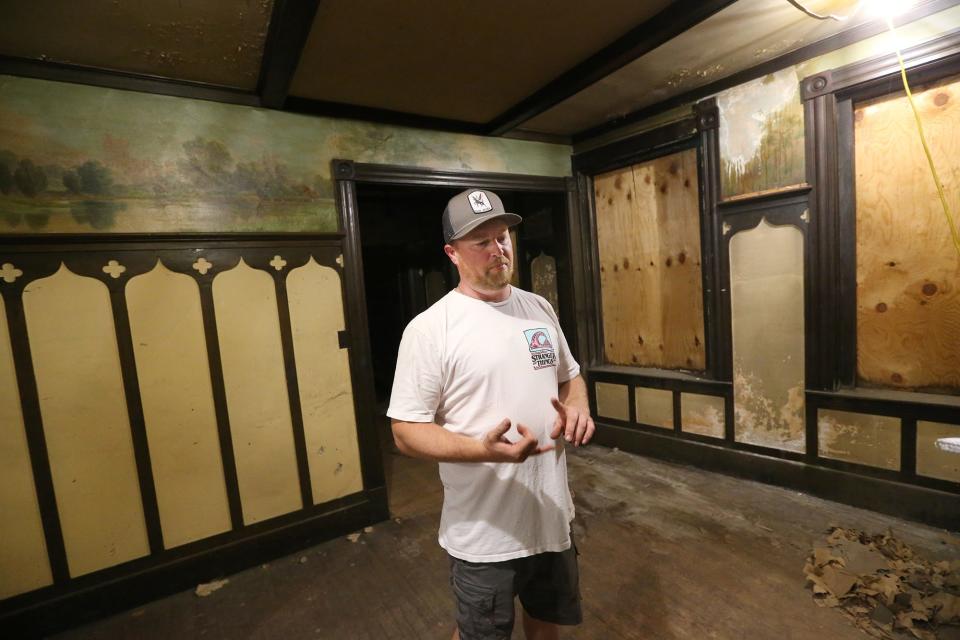 Derek Fisher, the founder and co-owner of Wing-Itz, has bought 256 and 262-264 Central Ave. in Dover, where he plans to relocate and expand his city location of the eatery. He stands in 264 Central Ave., which was once known as the Pythian Castle.