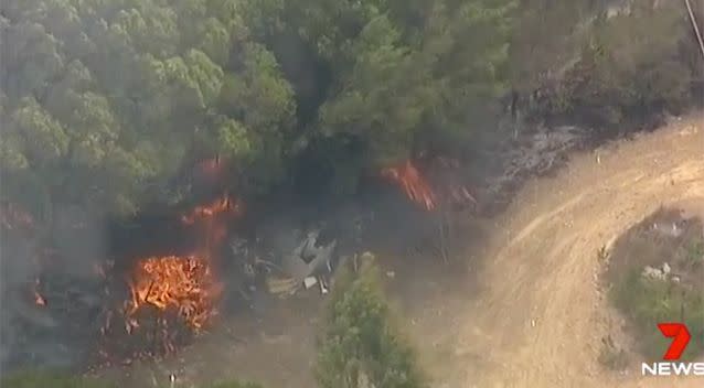 A bushfire broke out as a result of the crash. Source: 7 News