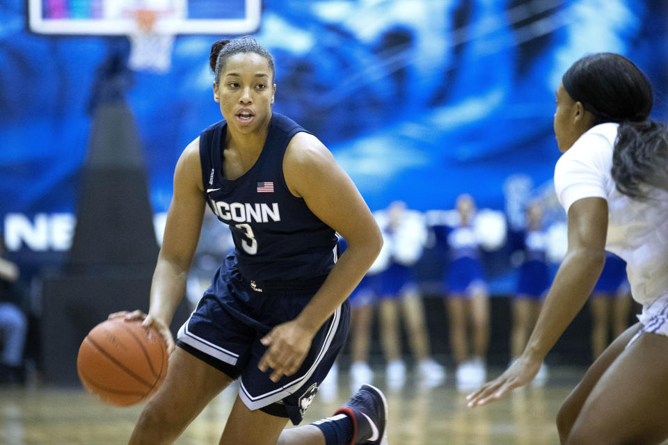 Connecticut forward Megan Walker (3) drives defended by Memphis guard Jamirah Shutes, right, in the first half of an NCAA college basketball game Tuesday, Jan. 14, 2020, in Memphis, Tenn. (AP Photo/Nikki Boertman)