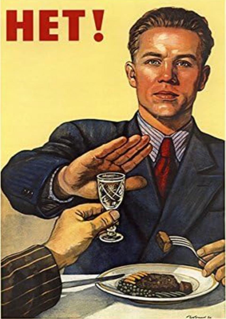 A Soviet poster shows a man in a suit refusing a glass of alcohol while eating, with the word "Het!" above him