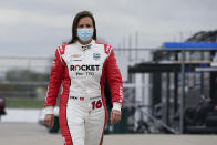 Simona De Silvestro, of Switzerland, walks through the garage area during testing at the Indianapolis Motor Speedway, Thursday, April 8, 2021, in Indianapolis. (AP Photo/Darron Cummings)