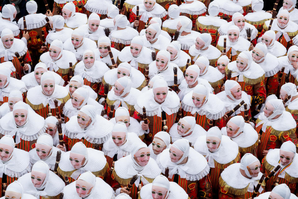 Festival participants known as 'Gilles', wearing traditional costumes, during Carnival celebrations in the streets of Binche, Belgium, March 5, 2019. (Photo: Stephanie Lecocq/EPA-EFE/REX/Shutterstock)