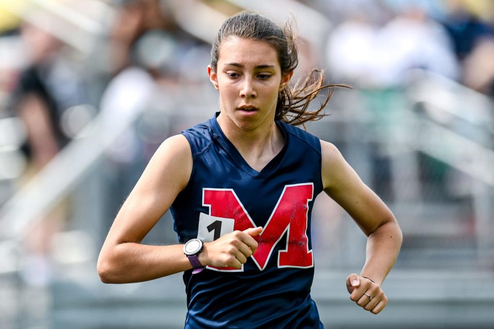 Mason's Meghan Ford competes in the 1600 meter race during the regional track meet on Friday, May 20, 2022, at Mason High School.