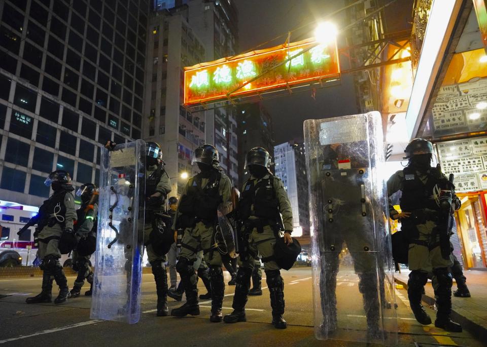 Policemen patrol in Hong Kong, Wednesday, Jan. 1, 2020. Hong Kong toned down its New Year’s celebrations amid the protests that began in June and which have dealt severe blows to the city’s retail, tourism and nightlife sectors. (AP Photo/Vincent Yu)