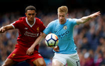 <p>Manchester City’s Kevin De Bruyne takes on Liverpool’s Trent Alexander-Arnold </p>