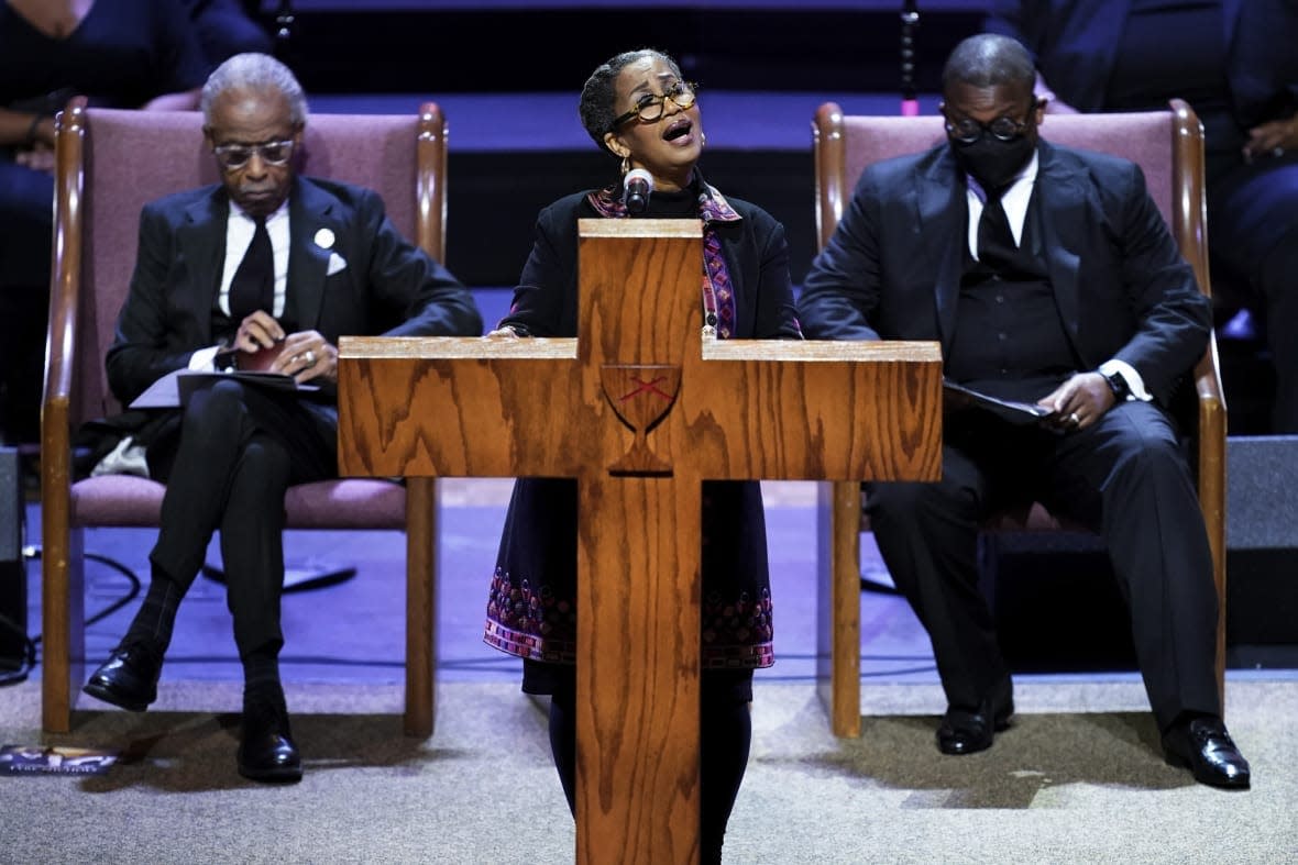 Rev. Dr. Rosalyn Nichols speaks during the funeral service for Tyre Nichols at Mississippi Boulevard Christian Church in Memphis, Tenn., on Wednesday, Feb. 1, 2023. At left is Rev. Al Sharpton and at right is Rev. Dr. J. Lawrence Turner. (Andrew Nelles/The Tennessean via AP, Pool)