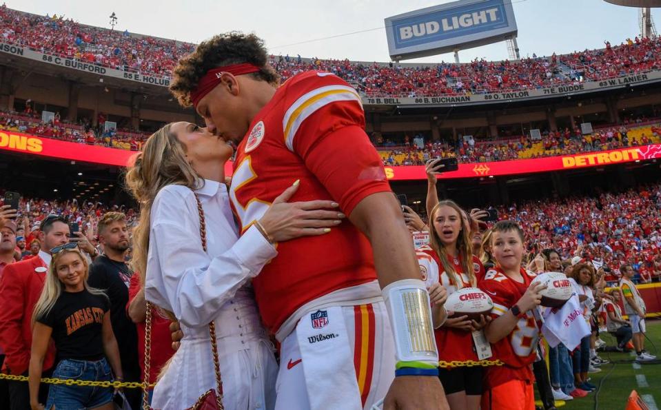Chiefs quarterback Patrick Mahomes kisses his wife, Brittany Mahomes, before kickoff of a game at GEHA Field at Arrowhead Stadium.