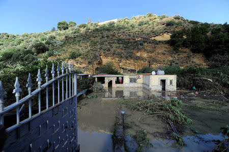 A general view shows a partially submerged house, where according to local media nine people died in, due to the flood-affected river Milicia, in Casteldaccia, near Palermo, Italy, November 4, 2018. REUTERS/Guglielmo Mangiapane