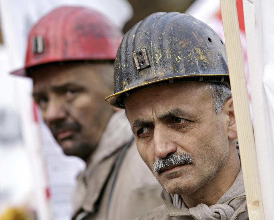 FILE--- In this picture taken Nov.6, 2007 dismissed coal miners of the company Deilmann Haniel demonstrate during the German coal convention day 2007 in the Philharmonic Concert Hall of Essen, Germany. (AP Photo/Volker Wiciok)