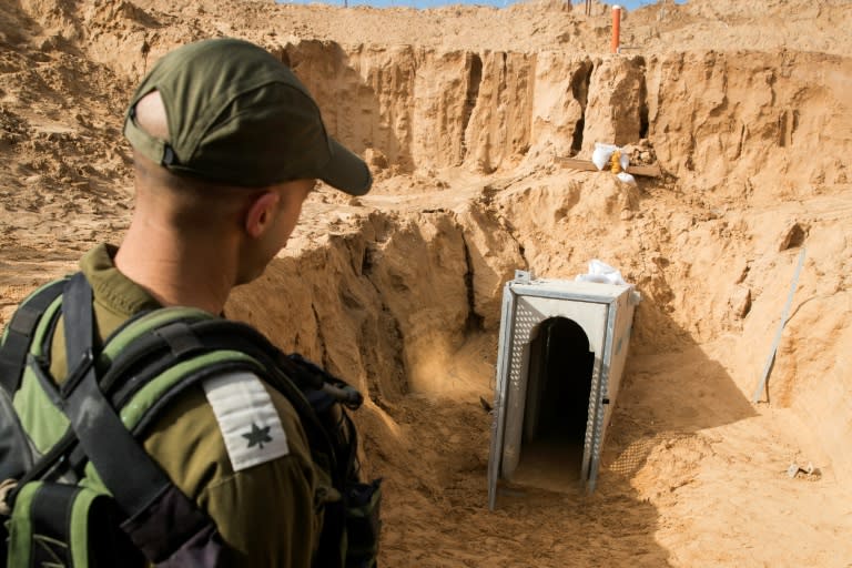 An Israeli officer walks near the entrance of a cross-border tunnel that Israel says was dug by the Islamic Jihad group from the Gaza Strip, on January 18, 2018