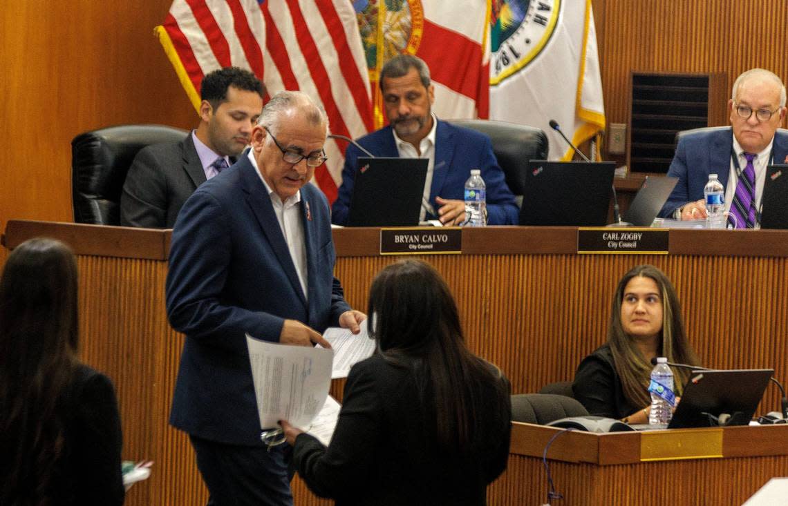 Hialeah Mayor Esteban Bovo Jr. during the city council meeting on Tuesday, October 24, 2023 where he was informed of the lawsuit against him filed by Councilman Bryan Calvo, photographed behind him. Pedro Portal/pportal@miamiherald.com