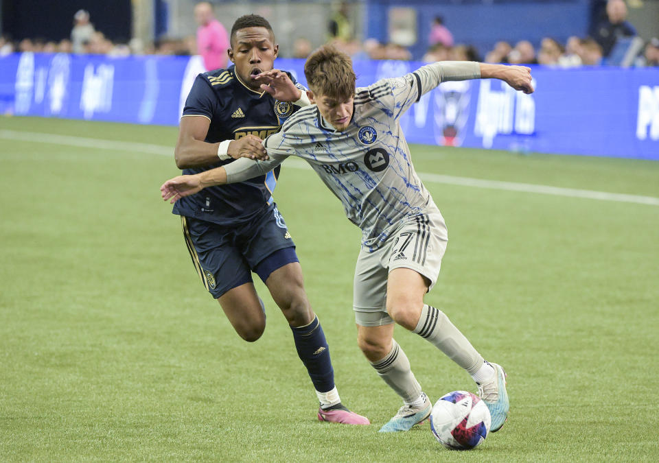 CF Montreal's Sean Rea (27) is challenged by Philadelphia Union's Andres Perea (6) during second-half MLS soccer match action in Montreal, Saturday, March 18, 2023. (Graham Hughes/The Canadian Press via AP)