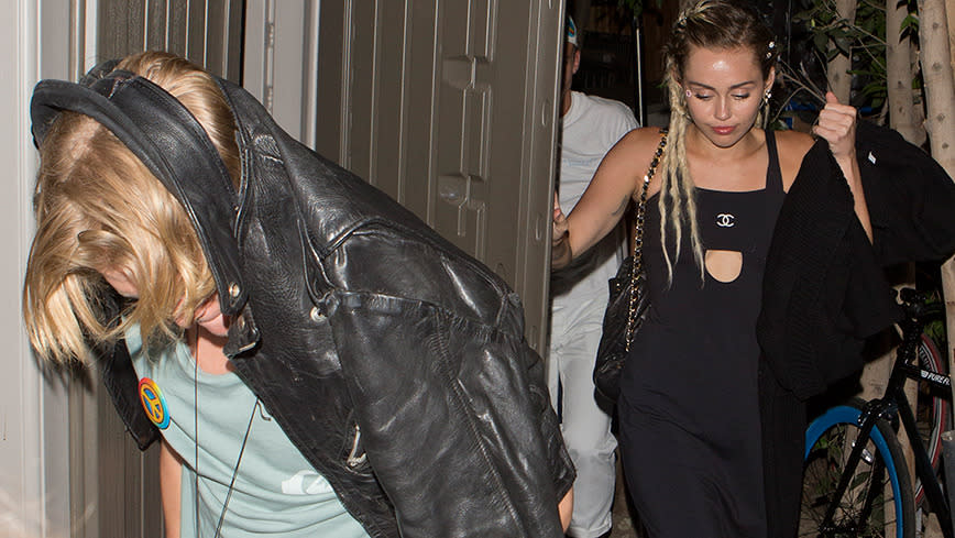 Miley Cyrus leaves bar with guy