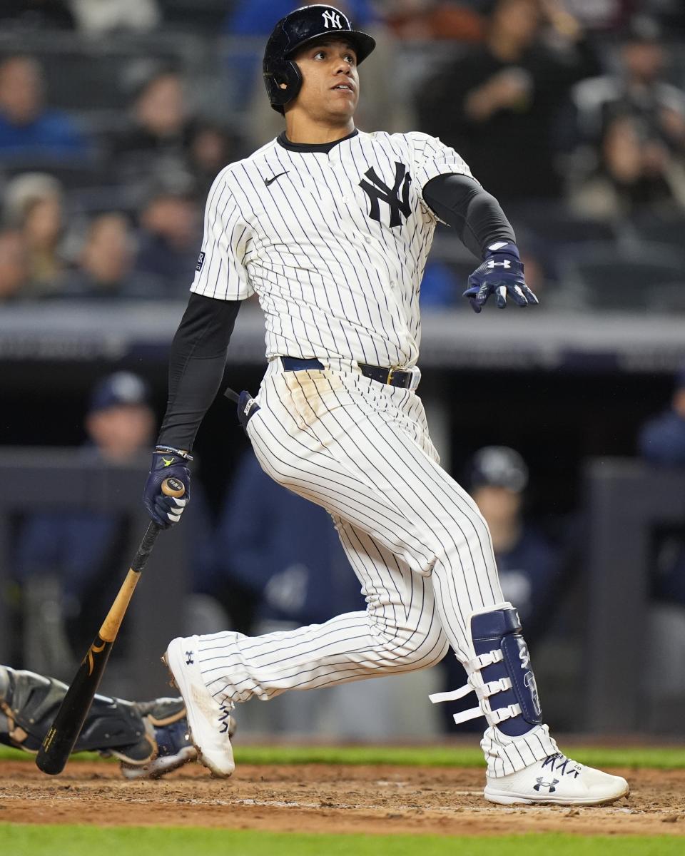 New York Yankees' Juan Soto follows through on a three-run home run during the seventh inning of a baseball game against the Tampa Bay Rays, Friday, April 19, 2024, in New York. (AP Photo/Frank Franklin II)