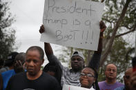 <p>Jorel Francois holds a sign that reads, “President trump is a Bigot!!!” as he joins with others to mark the 8th anniversary of the massive earthquake in Haiti and to condemn President Donald Trump’s reported statement about immigrants from Haiti, Africa and El Salvador on Jan. 12, 2018 in Miami, Fla. (Photo: Joe Raedle/Getty Images) </p>