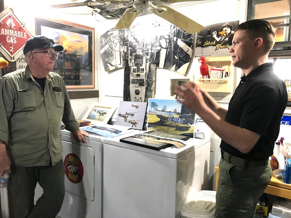 “Hail Our Heroes!” adviser Dako Morfey chats with retired Air Force Gen. Clay McCutchan about World War II airplanes the general and his team will exhibit at Crestview Bob Sikes Airport during the April 22-24 reenactment weekend.