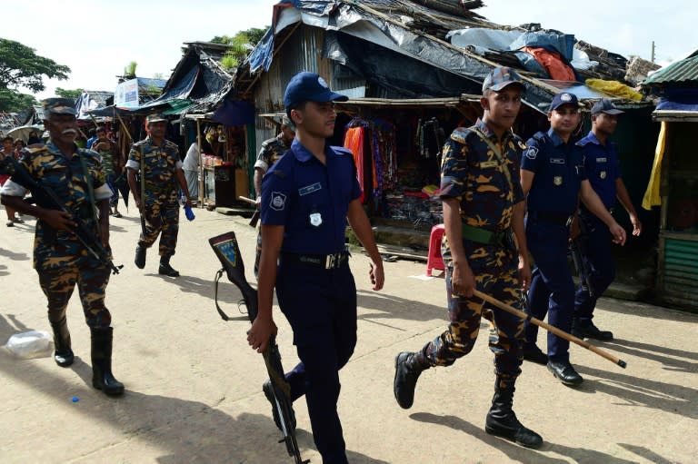 Bangladeshi police patrol in one of the Rohingya refugee camps on the border with Myanmar, where a spate of grisly murders is fuelling unease