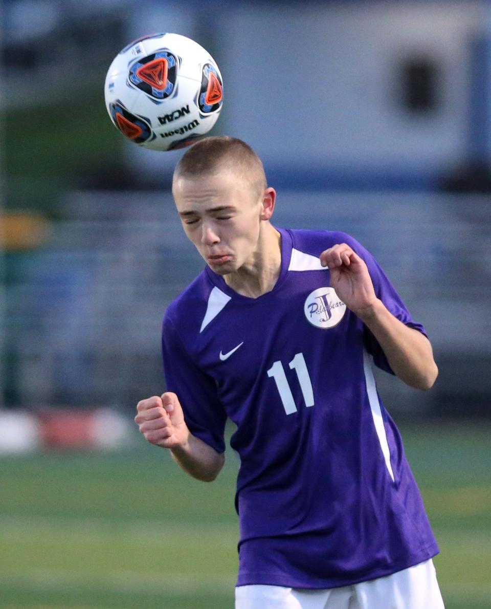 Conlan Wanzer, of Jackson goes for a header during their DI regional semifinal against University School at Twinsburg on Wednesday, Nov. 3, 2021.