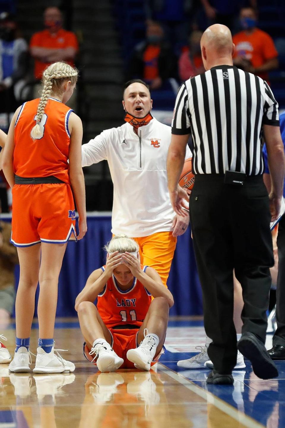 Marshall County’s Cayson Conner (11) and Coach Aaron Beth react to a call late in the fourth quarter of Sacred Heart’s state championship win in Rupp Arena on Saturday night. Conner fell to the floor trying to collect an inbounds pass with 1.3 seconds remaining but no foul was whistled.