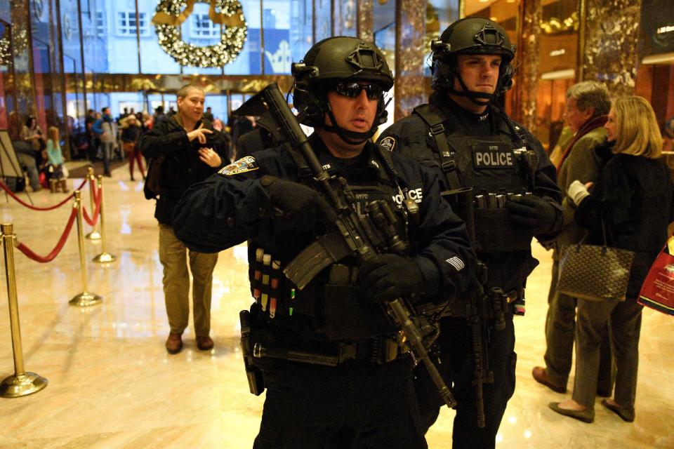 Heavily armed New York City Police (NYPD) officers patrol inside Trump Tower where Republican president-elect Donald Trump lives in the Manhattan borough of New York, U.S., December 4, 2016. REUTERS/Darren Ornitz