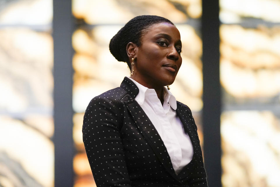 Khady Kamara, executive director of the Perelman Performing Arts Center, listens as former New York City Mayor Michael Bloomberg speaks at a news conference to announce the center's inaugural season events calendar, Wednesday, June 14, 2023, in New York. (AP Photo/John Minchillo)