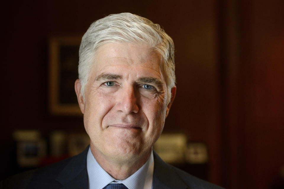 Supreme Court Justice Neil Gorsuch poses for a portrait in his office at the Supreme Court, Monday, July 29, 2024, in Washington. Gorsuch is out with a new book in which he says ordinary Americans are "getting whacked" by too many laws and regulations. "Over Ruled: The Human Toll of Too Much Law" is being published on Tuesday, Aug. 6. (AP Photo/Rod Lamkey, Jr.)